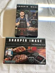 Sharper Image Grill Instructor Apron & Bluetooth Intelligent Thermometer. Fixed Price $29.99.